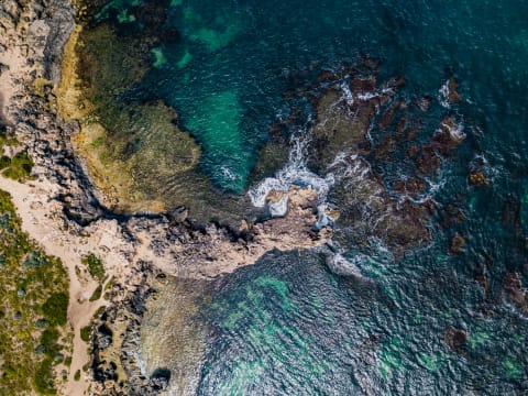 waves breaking over rocks | Soar